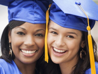 college graduates smiling together