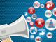 Illustration of a megaphone broadcasting political messages on a star-spangled blue background.