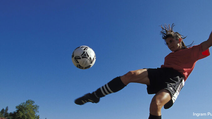 071519_01P_FS woman kicking soccer ball