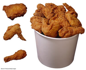 Bucket of fried chicken pieces