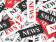 red, black, white "news" elements in a jumbled pile