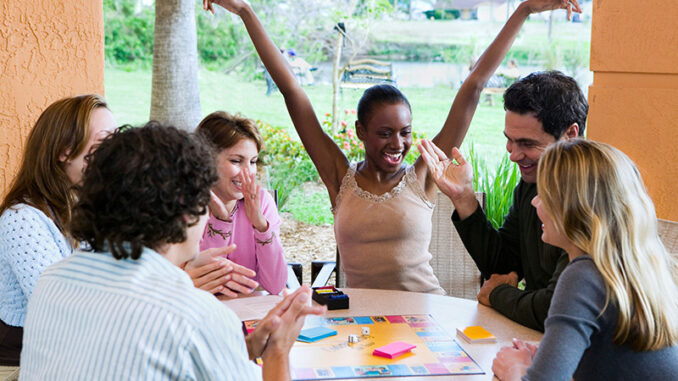 Group of People Playing A Board Game Group of People Playing A Board Game