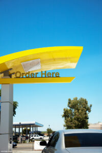 Drive thru fast food restaurant with Order Here sign
