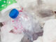 Image of trash bin with waste plastic bottles and bags. Plastic Waste Pollution