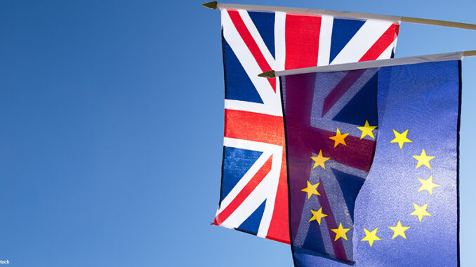European Union and British Union Jack flag flying in front of bright blue sky in preparation for the Brexit EU referendum