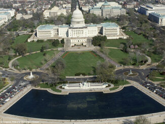 Aerial view of the National Mall, focusing on the United States Capitol Building and grounds with the Reflecting Pool in the forground, Washington D.C.,