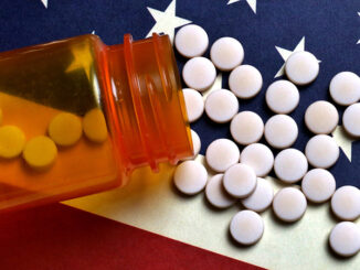 Prescription Pills spilled on USA flag