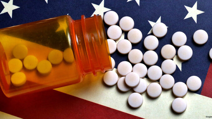 American Healthcare Prescription Pills spilled on USA flag