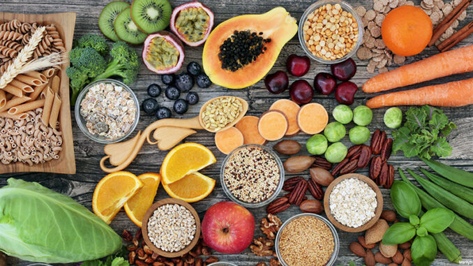 120919_01P_FS High dietary fibre health food concept with fruit, vegetables, whole wheat pasta, legumes, cereals, nuts and seeds