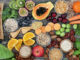 High dietary fibre health food concept with fruit, vegetables, whole wheat pasta, legumes, cereals, nuts and seeds