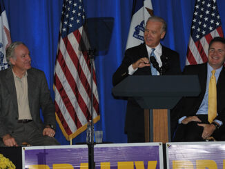 Vice President Joe Biden (center), Senator Tom Harkin (left), and Congressman Bruce Braley (right), on stage at a 2010 mid-term election political rally in Dubuque, Iowa.