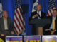 Vice President Joe Biden (center), Senator Tom Harkin (left), and Congressman Bruce Braley (right), on stage at a 2010 mid-term election political rally in Dubuque, Iowa.