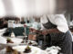 Chef finishing dishes at restaurant