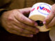 I voted stickers being passed out to people at a polling station