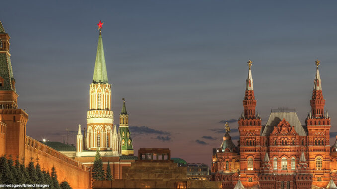 Illuminated ornate buildings, Moscow, Russia Illuminated low-angle view looking northwest of Lenin's Mausoleum and State Museum of Red Square, Kremlin, Moscow, Russia.