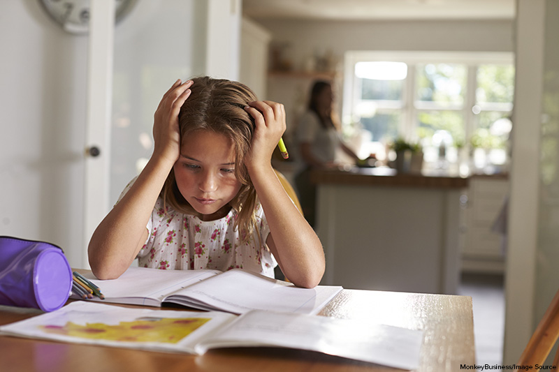 Girl frustrated by difficult homework