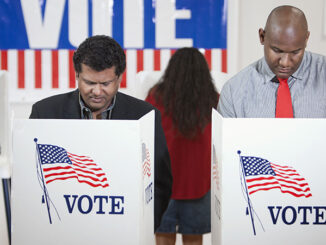 Voters voting in polling place