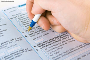 a person filling out a form