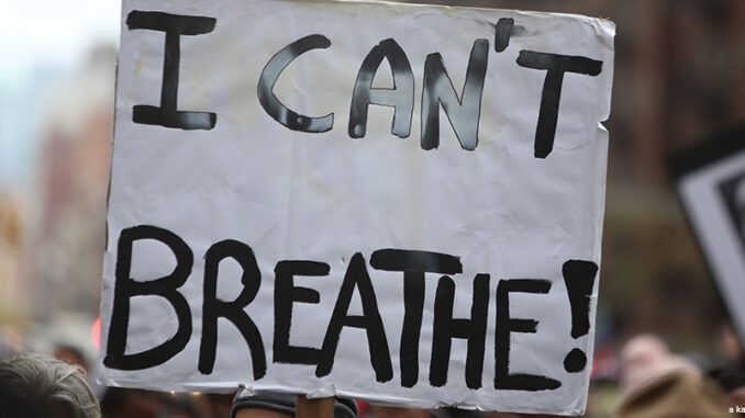 NEW YORK CITY - OCTOBER 24 2015: More than one thousand activists marched on behalf of the families of victims of alleged police brutality in RiseUpOctober Close-up view of a sign reading "I Can't Breathe"