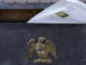 home-mounted mailbox with letter sticking out the top
