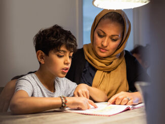 Mother and son reading at home