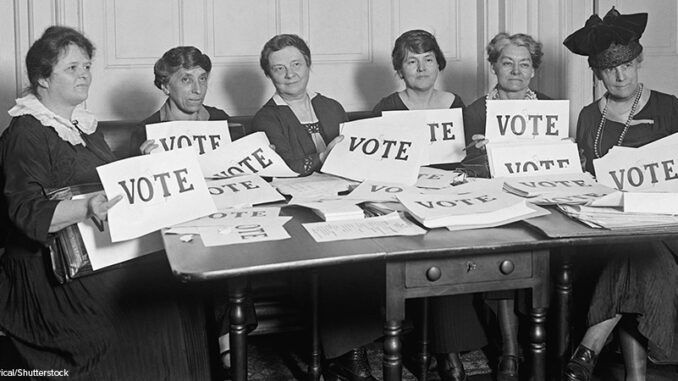 National League of Women Voters hold up signs reading, 'VOTE', Sept. 17, 1924. Millions of women voted in 1920 and 1924, but in a lower proportion than men. black and white photo of members of the National League of Women Voters