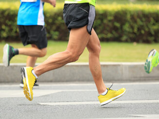 photo of runners from the waist down, focused on moving legs