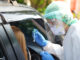 Medical personnel conducting a COVID test