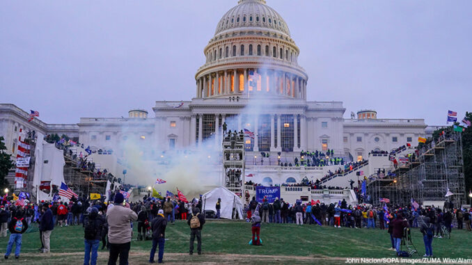 New York, NY, USA. 6th Jan, 2021. Capitol police deploys tear gas and flash bangs to disperse protestors during the protest.Pro-trump supporters stormed U.S. Capitol building in Washington, after the U.S. President-elect Joe Biden condemned what he called 6th Jan, 2021. the U.S. Capitol Building is clouded by tear gas during protest