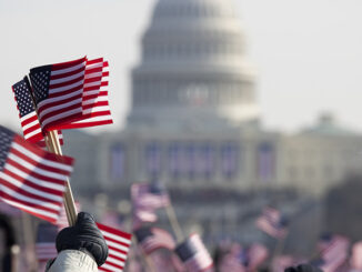 flag waving crowds at Presidential Inauguration at Capitol Building, Washington D.C.