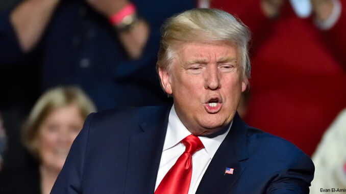 HERSHEY, PA - DECEMBER 15, 2016: President Donald Trump dynamic pointing toward the crowd at a "Thank You Tour" rally held at the Giant Center former president Donald Trump