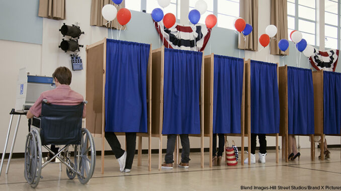 People voting in polling place People voting in polling place