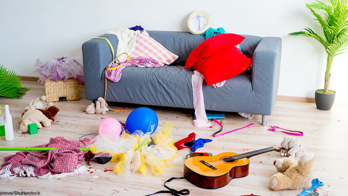 030821_03P_FS toys scattered around a room in front of a couch
