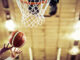 Basketball going in hoop at basketball game