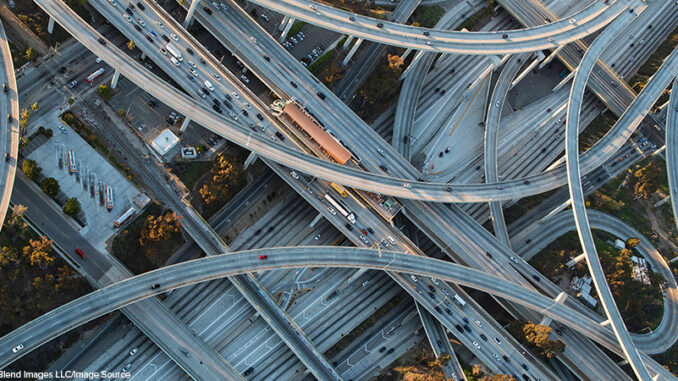 Aerial view of highway interchange in cityscape