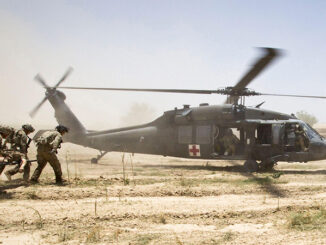U.S. Army soldiers move towards a Medevac helicopter in southern Afghanistan
