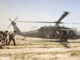 U.S. Army soldiers move towards a Medevac helicopter in southern Afghanistan