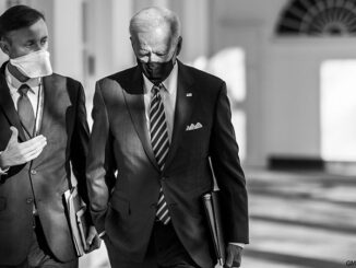 President Joe Biden walks with National Security Adviser Jake Sullivan along the Colonnade of the White House