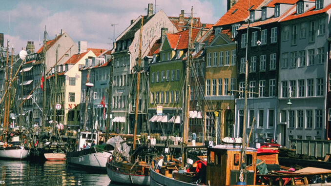 Boats in a canal in front of buildings, Copenhagen, Denmark Boats in a canal in front of buildings, Copenhagen, Denmark