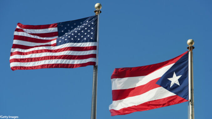 Puerto Rico, Old San Juan, flags of the USA and Puerto Rico The United States flag and the Puerto Rico flag flying on flagpoles