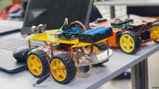Kit models and laptops on the table on robotics