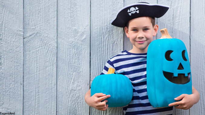 101821_03P_FS boy holds a teal pumpkins. Teal Pumpkin Project