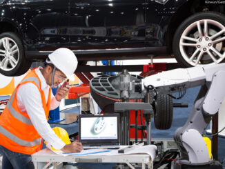 Automotive engineer working to manufacture a car
