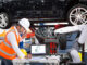 Automotive engineer working to manufacture a car