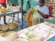 Gullah vendors making and selling sweetgrass baskets in Charleston City Market in Charleston, South Carolina