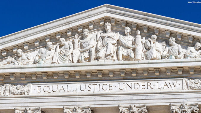 Washington DC. Main frieze of the US Supreme Court Building. On the architrave the famous words Equal Justice Under Law Main frieze of the US Supreme Court Building