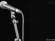 Close-Up Of Microphone on stand with a black background