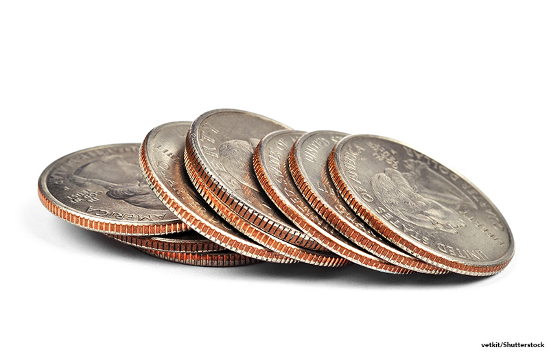 pile of one quarter coins isolated on white