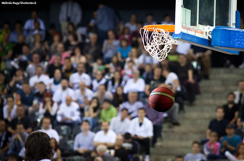 Blurred background of crowd of people in a basketball court