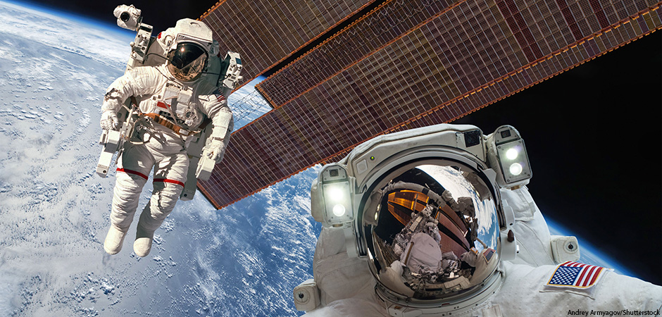 International Space Station and astronaut in outer space over the planet Earth.
